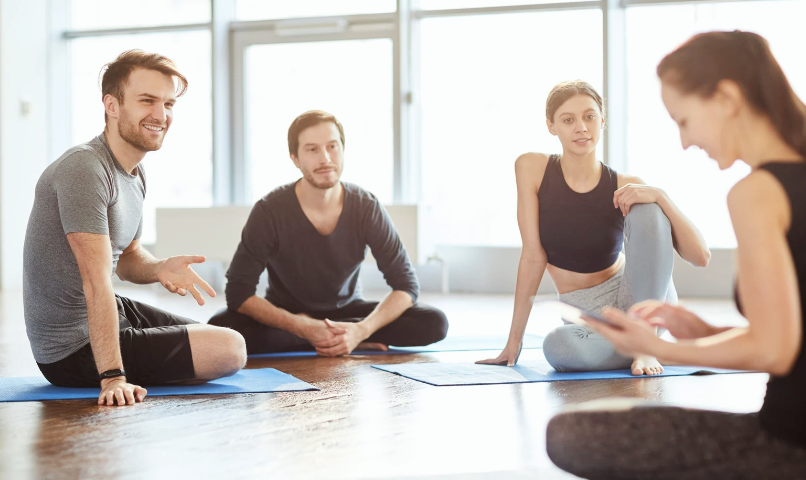 group of people on yoga mats