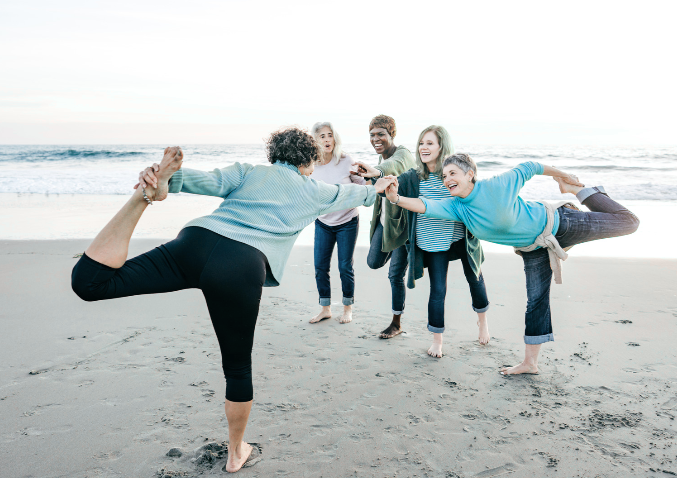 group of people doing yoga outside
