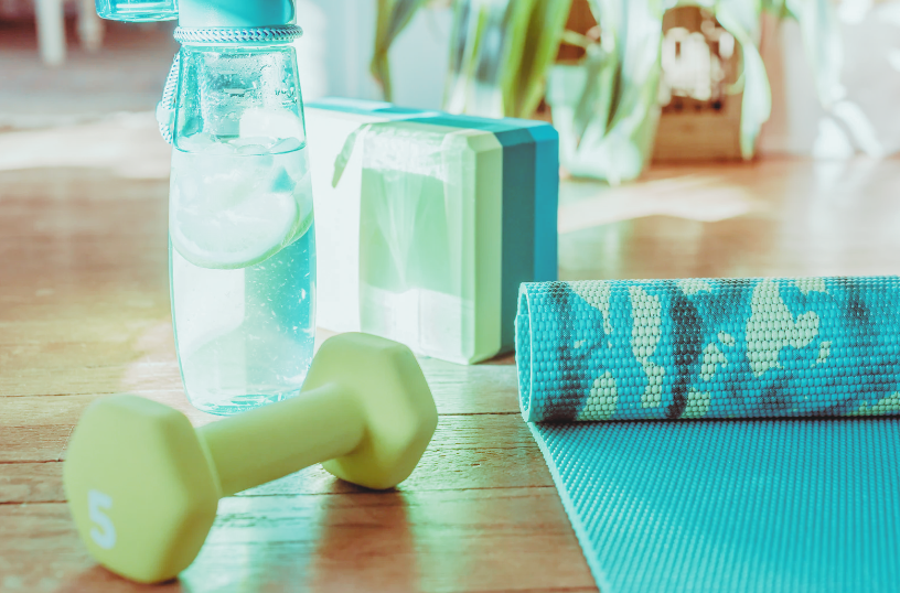 yoga mat, block, weight and water bottle
