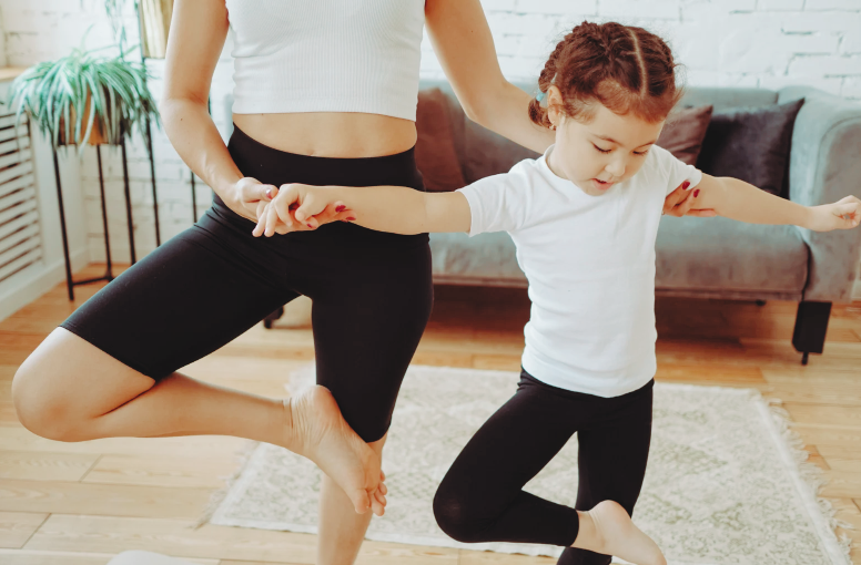 adult and child doing yoga